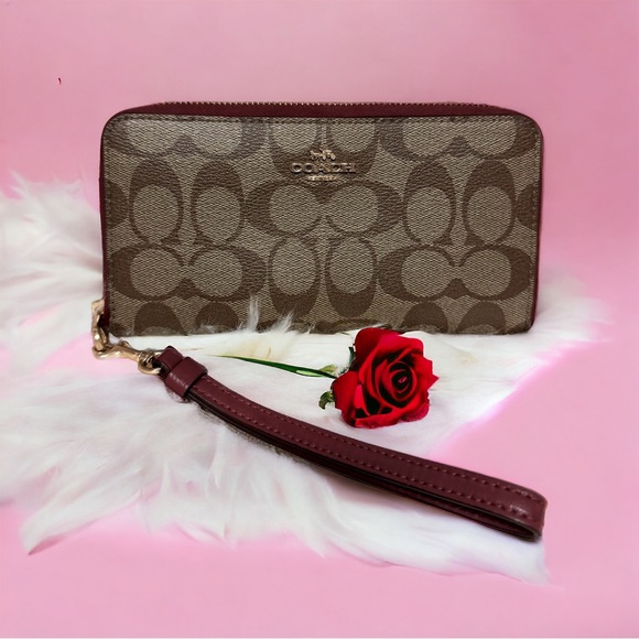 Coach Handbags - 48 hour Sale Coach Signature Long Zip Around Wallet In Signature Canvas Cherry